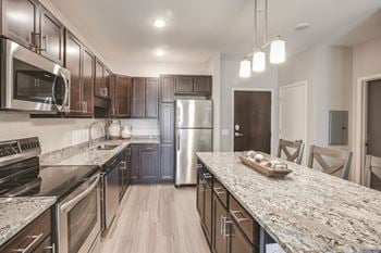 Warm tone kitchen option at frost english sliver 55+ senior living